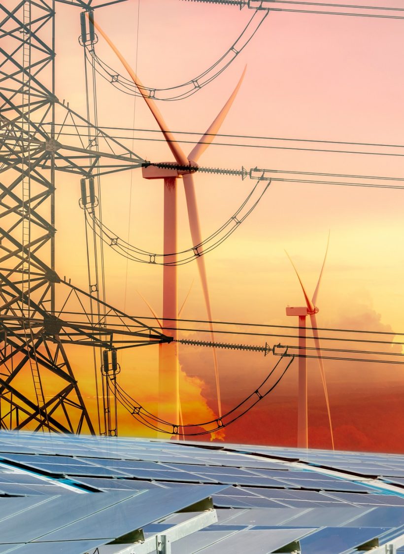 Sustainable energy. Solar farm, wind turbine, and electric pylon with sunset sky. Sustainable resources. Solar, wind power. Renewable energy. Green energy. Carbon neutrality and net zero emissions.